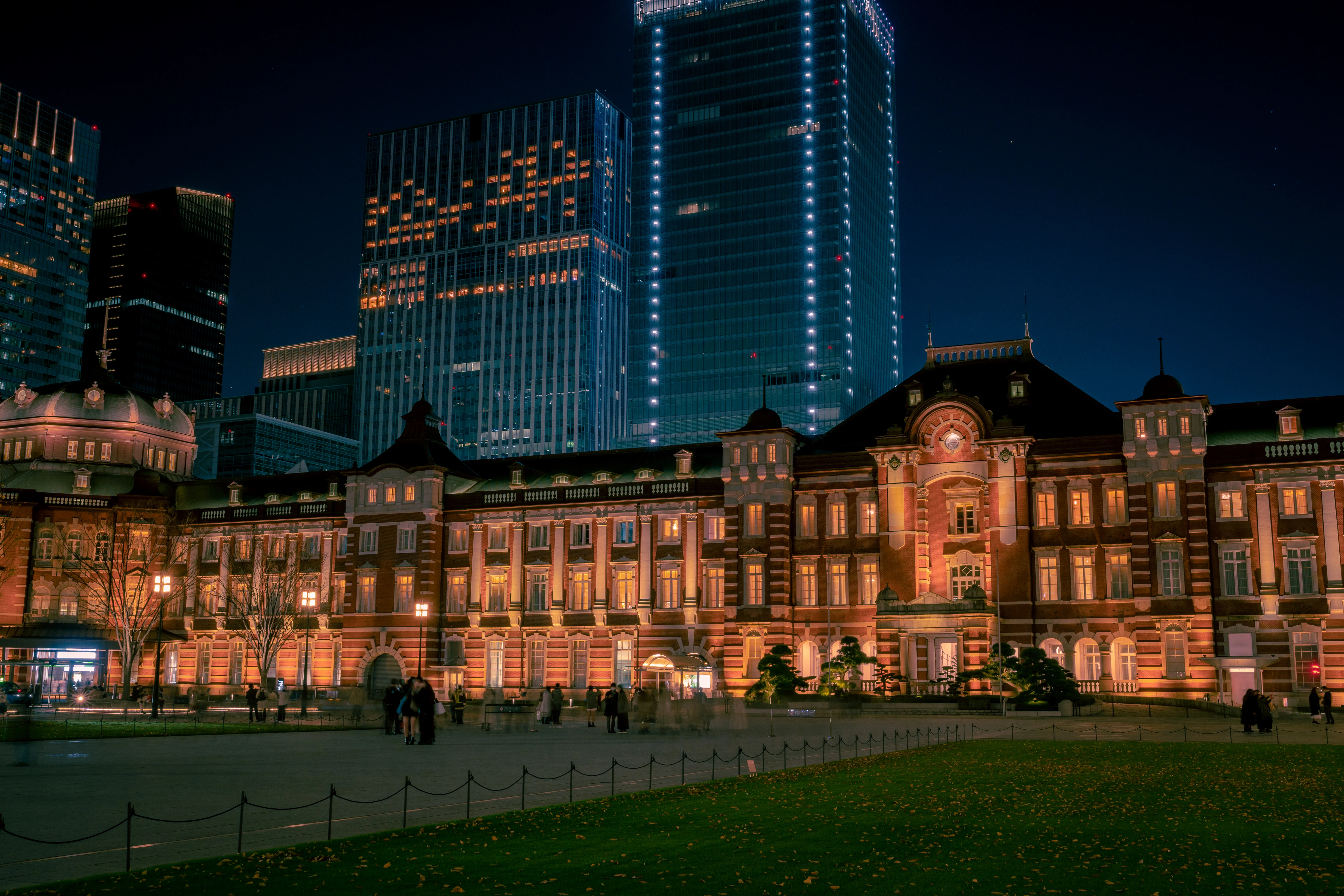 Tokyo Station Illuminated Against A Nighttime Skyline