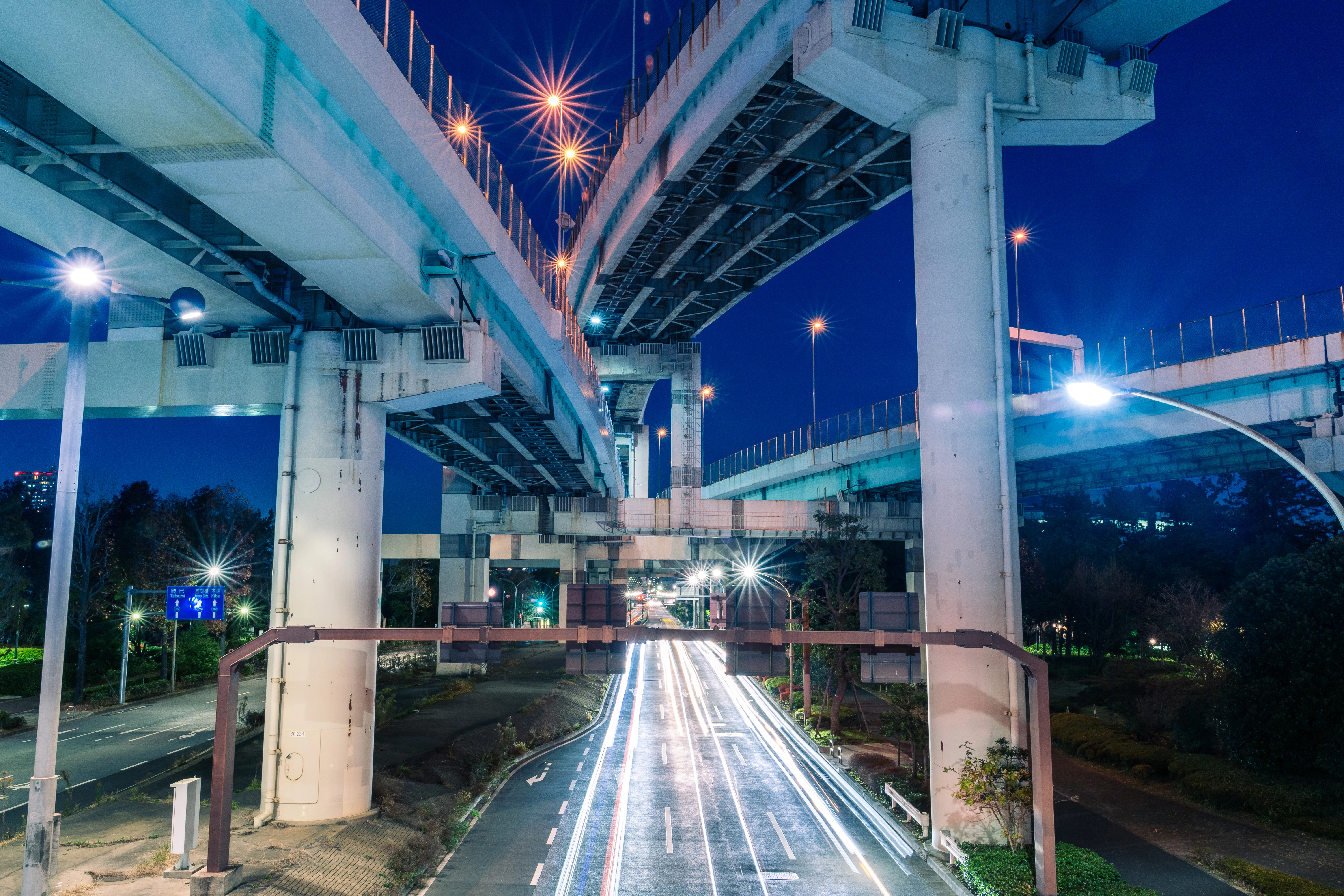 Illuminated Urban Expressway and Night Traffic Trails