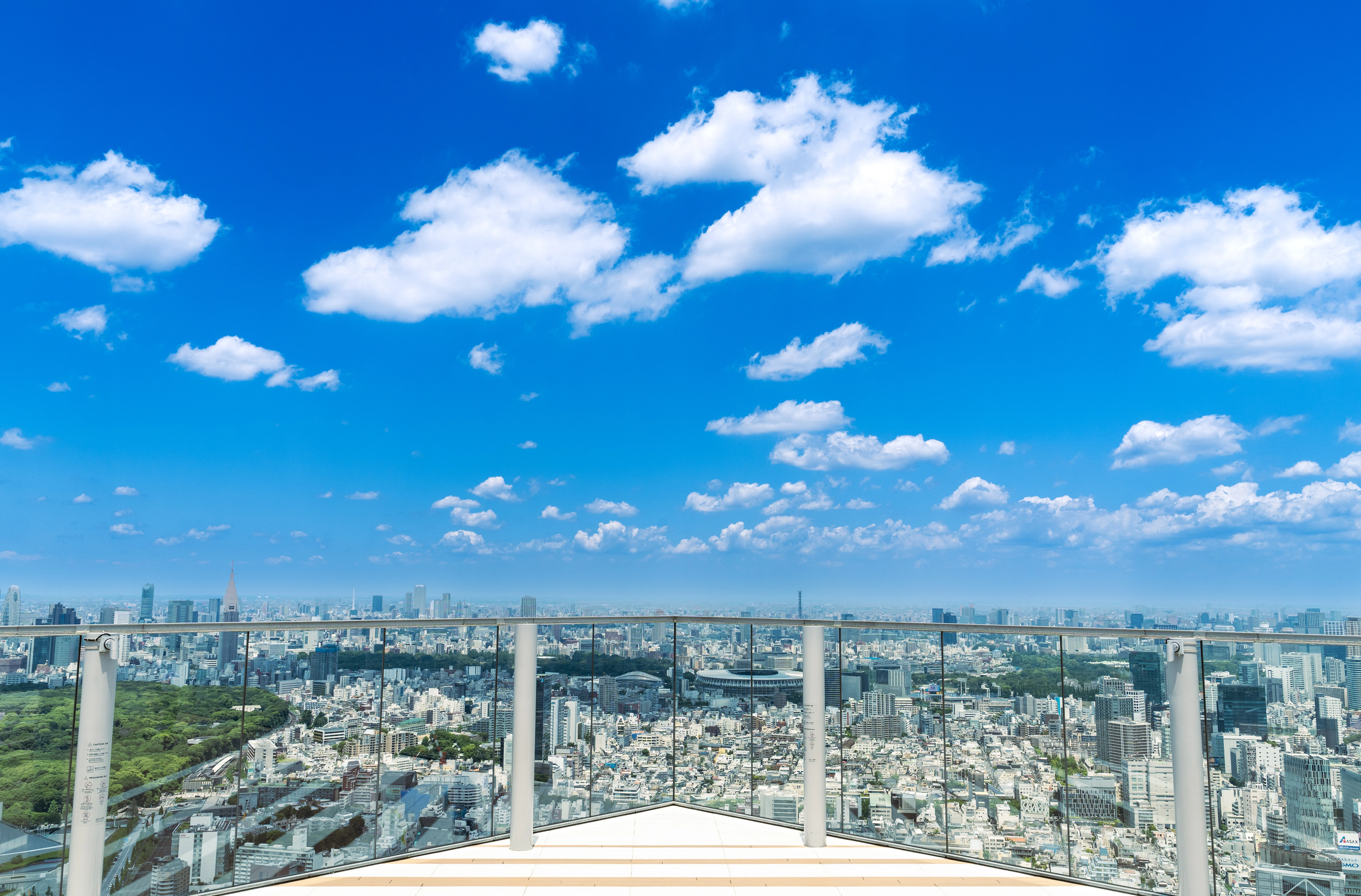 Expansive Urban Skyline Under a Vibrant Blue Sky