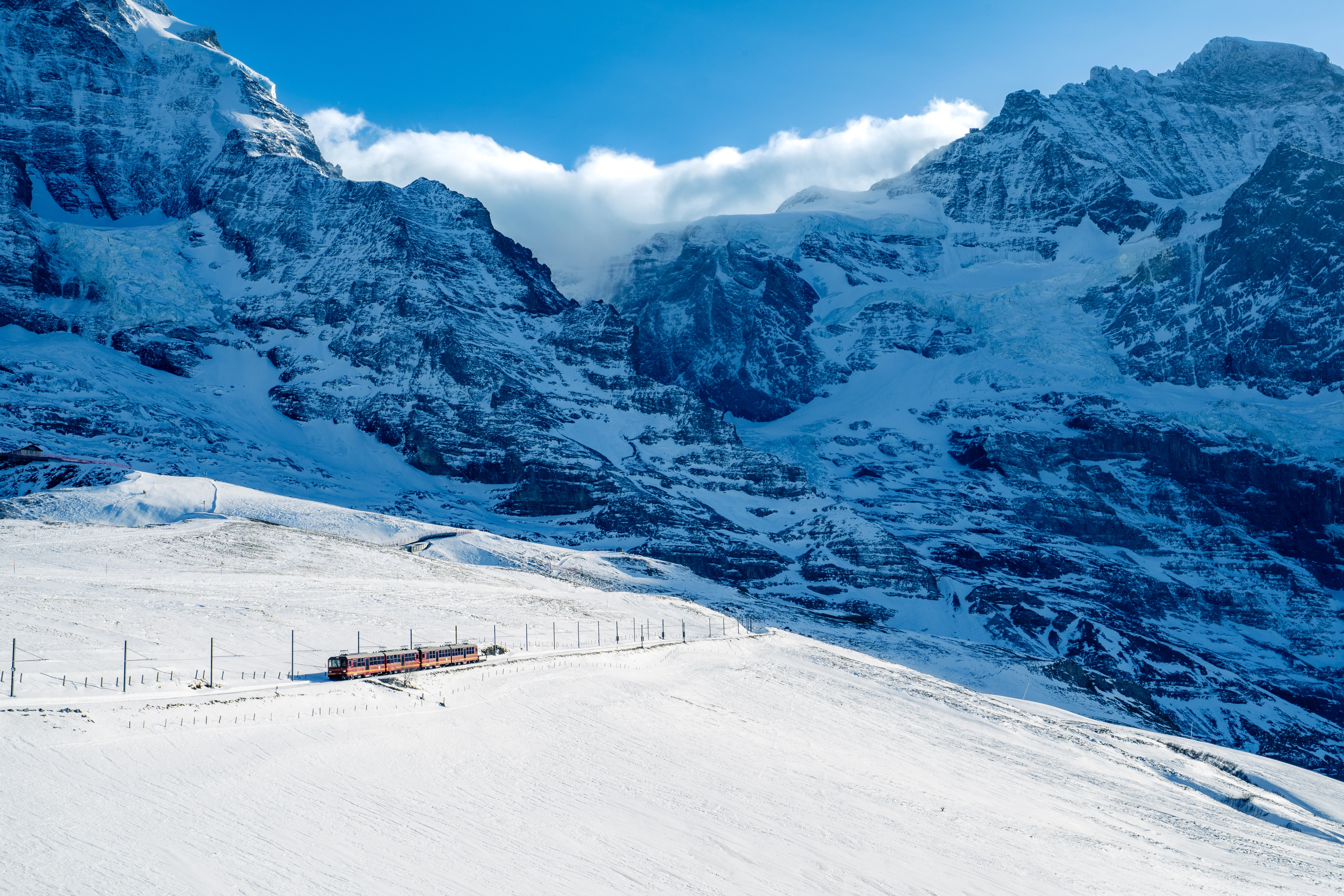 Red Thread Across the Alpine Snow