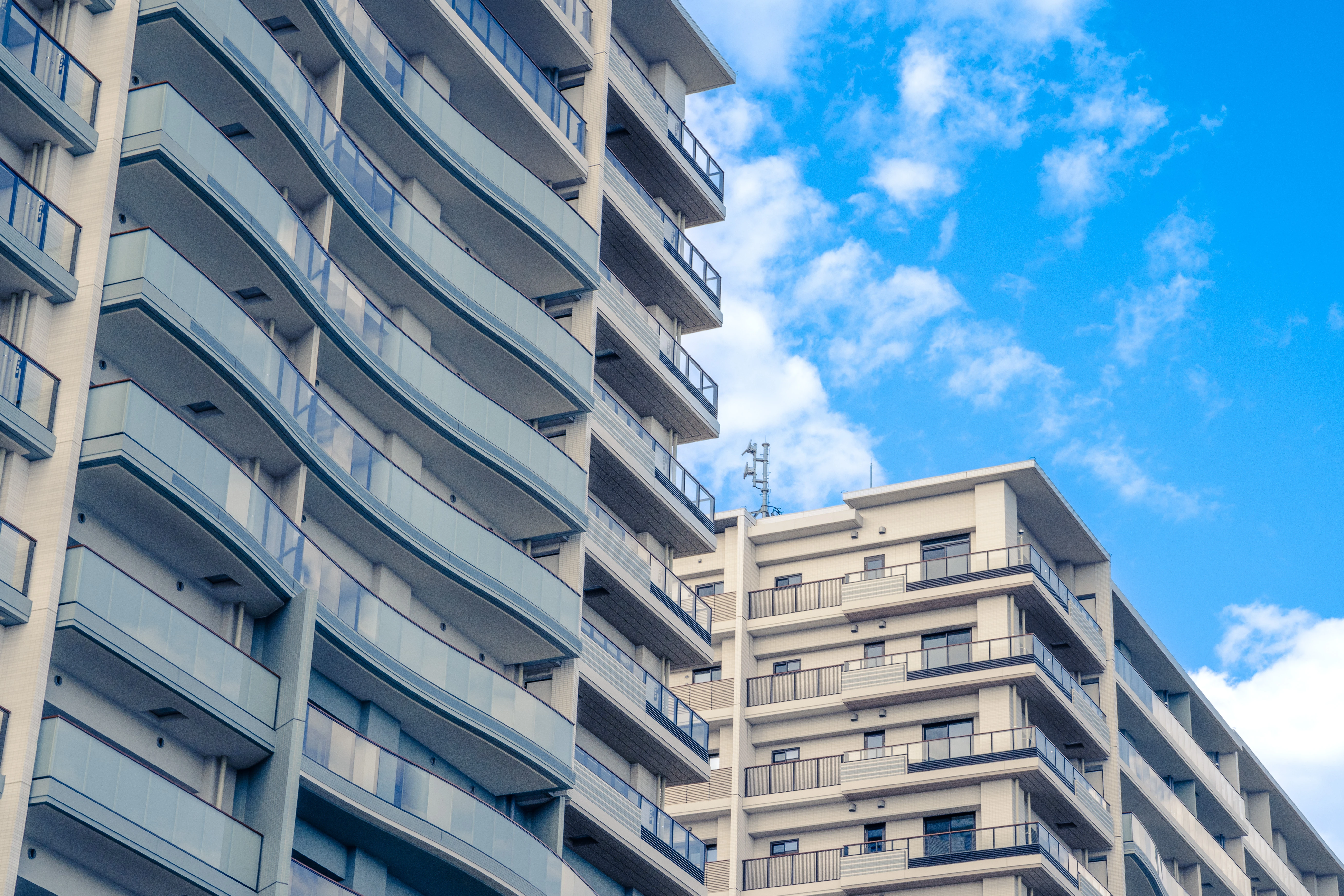 Modern Urban Apartment Design Against a Clear Blue Sky