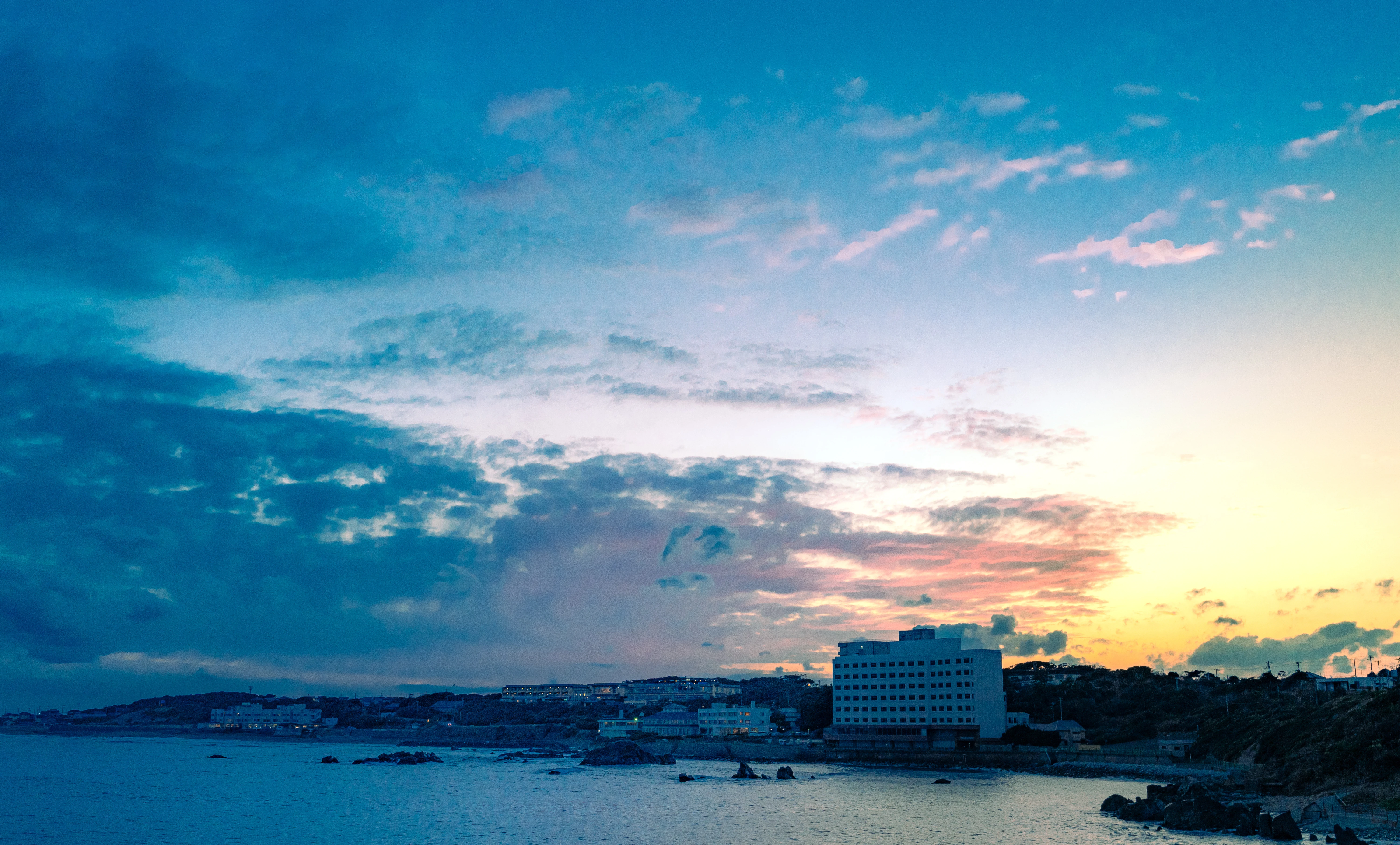 Twilight Glow Over Coastal Town Horizon