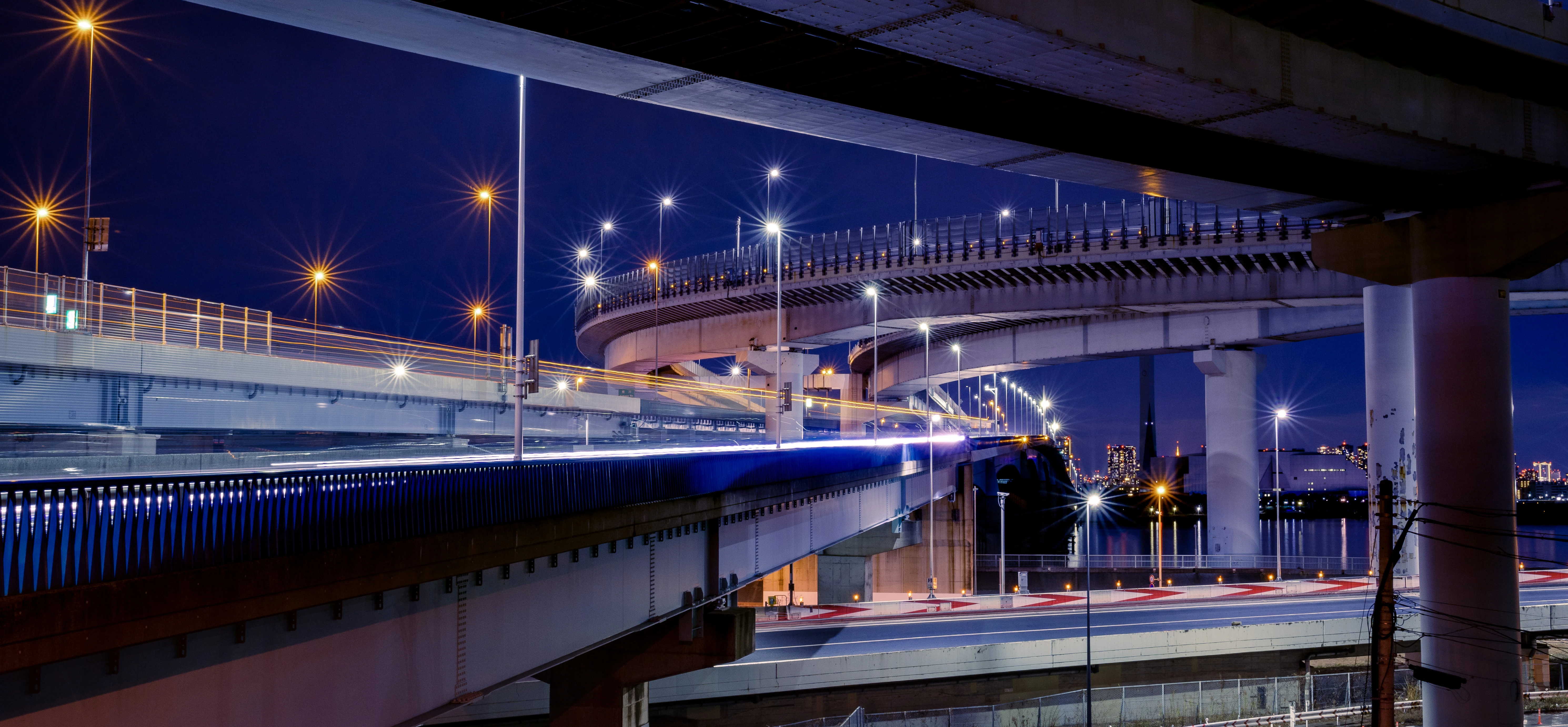 Illuminated Curved Expressway at Night