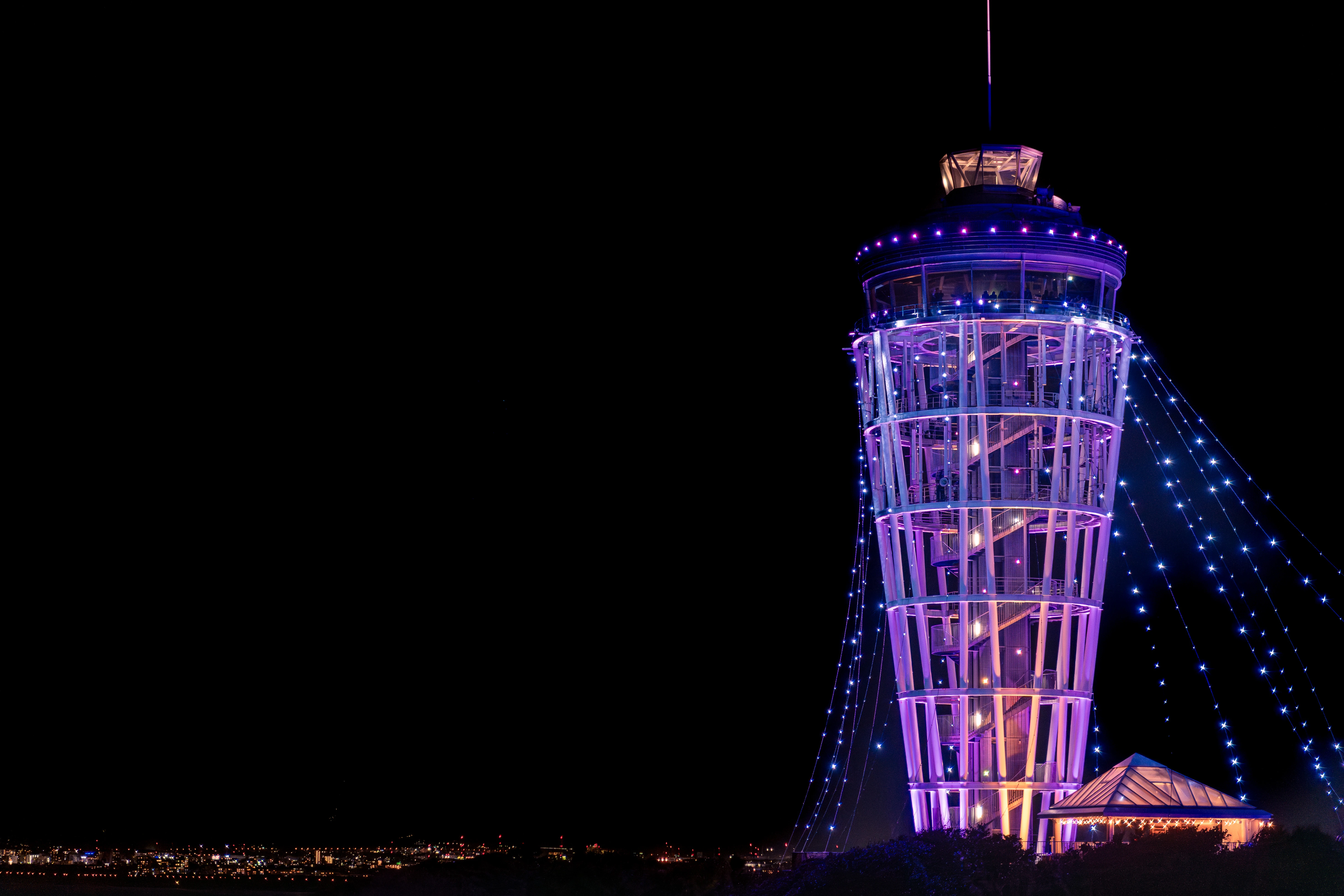 Illuminated Tower of Enoshima: Nighttime Vibrance and Elegance