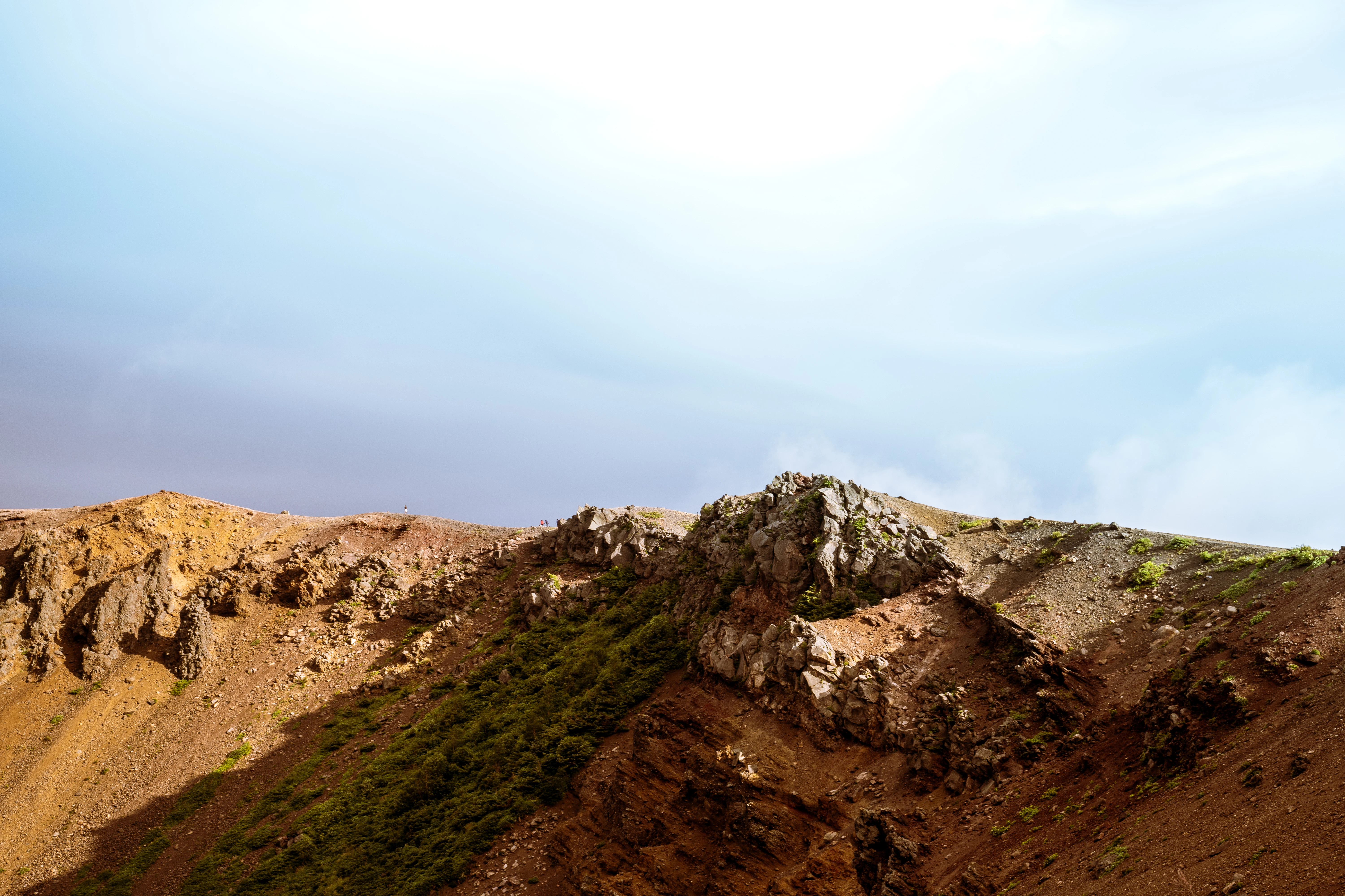 Arid Ridge Under Vast Blue Sky