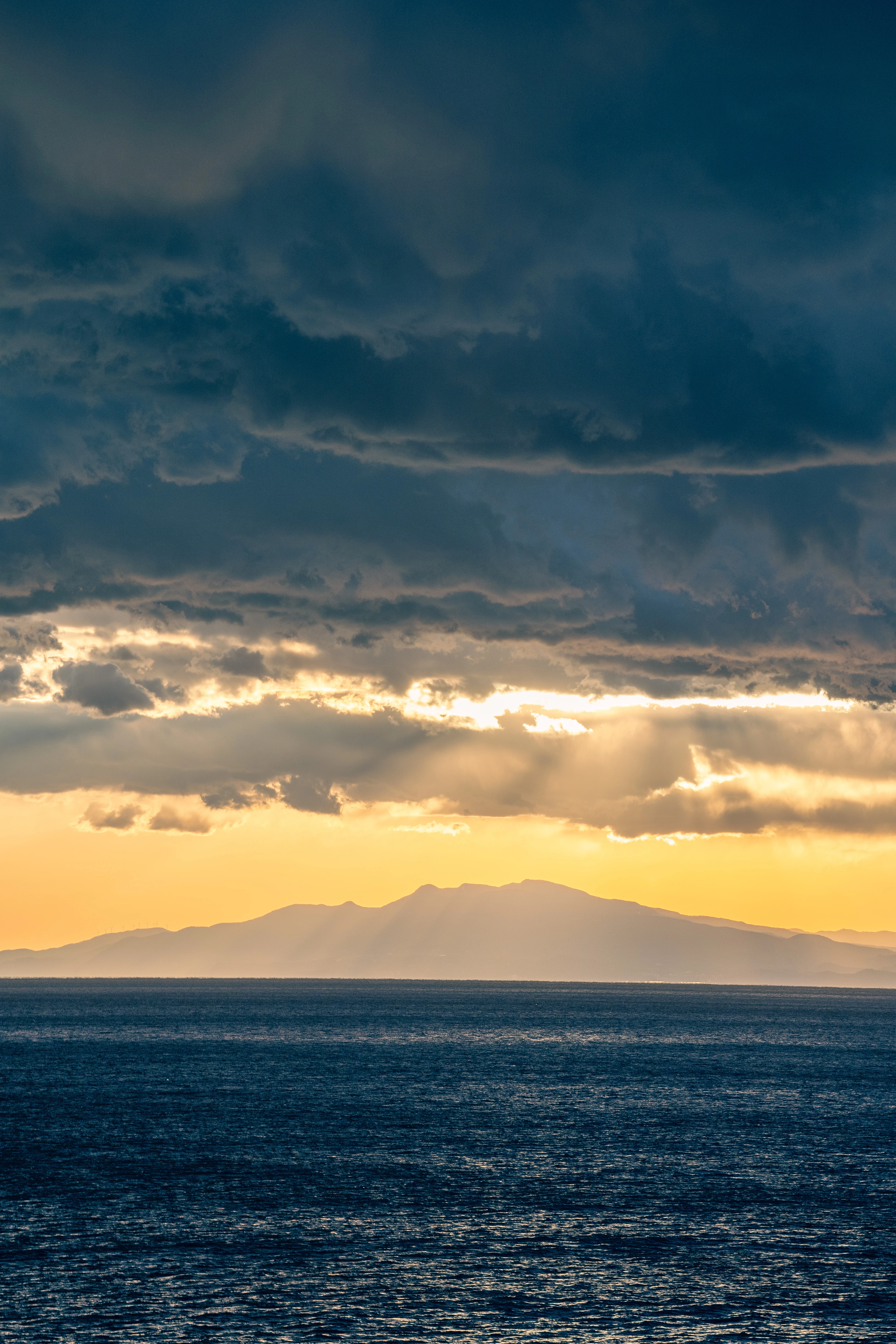 Golden Rays Piercing Through the Stormy Clouds