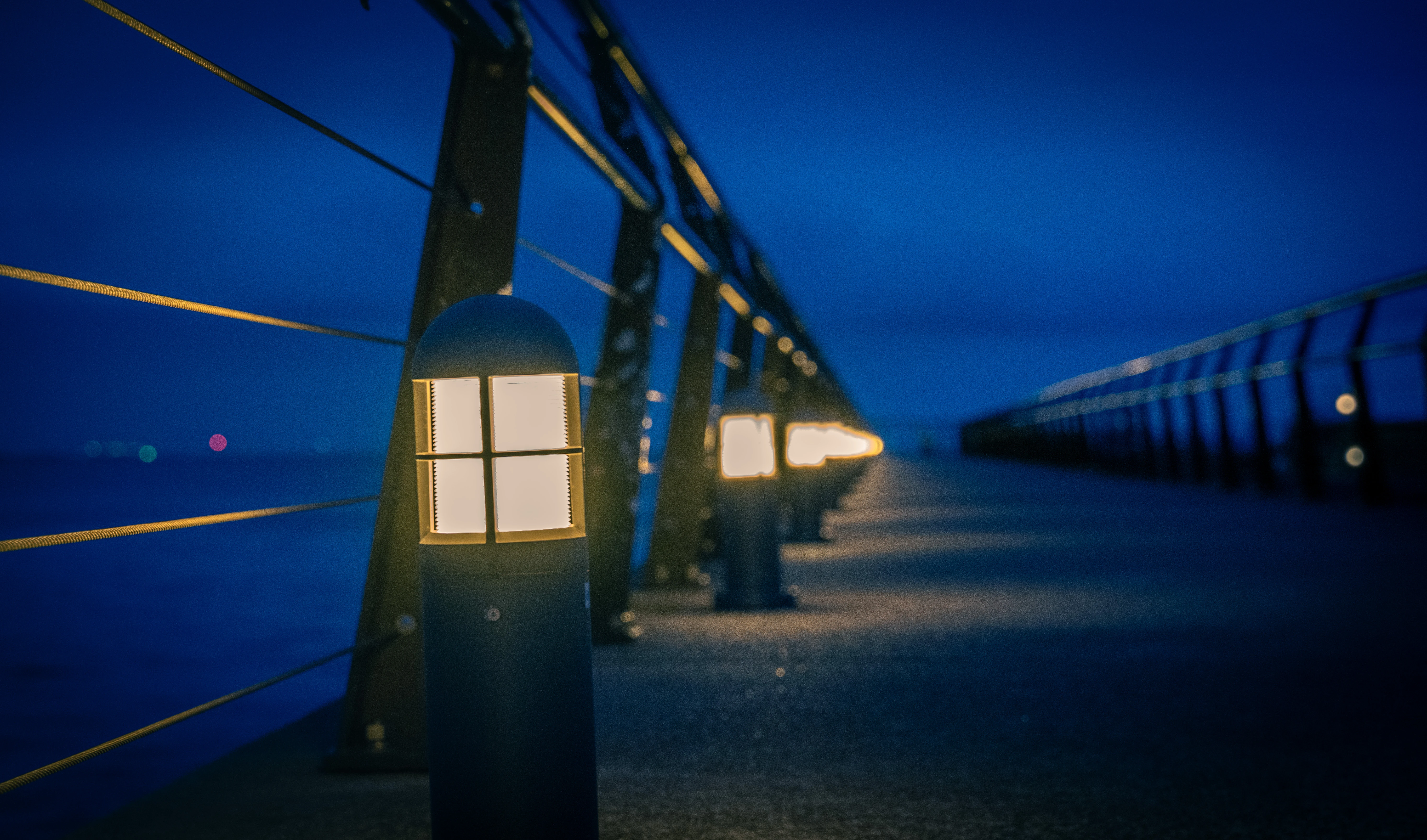 Tranquil Night Walk by the Illuminated Pier