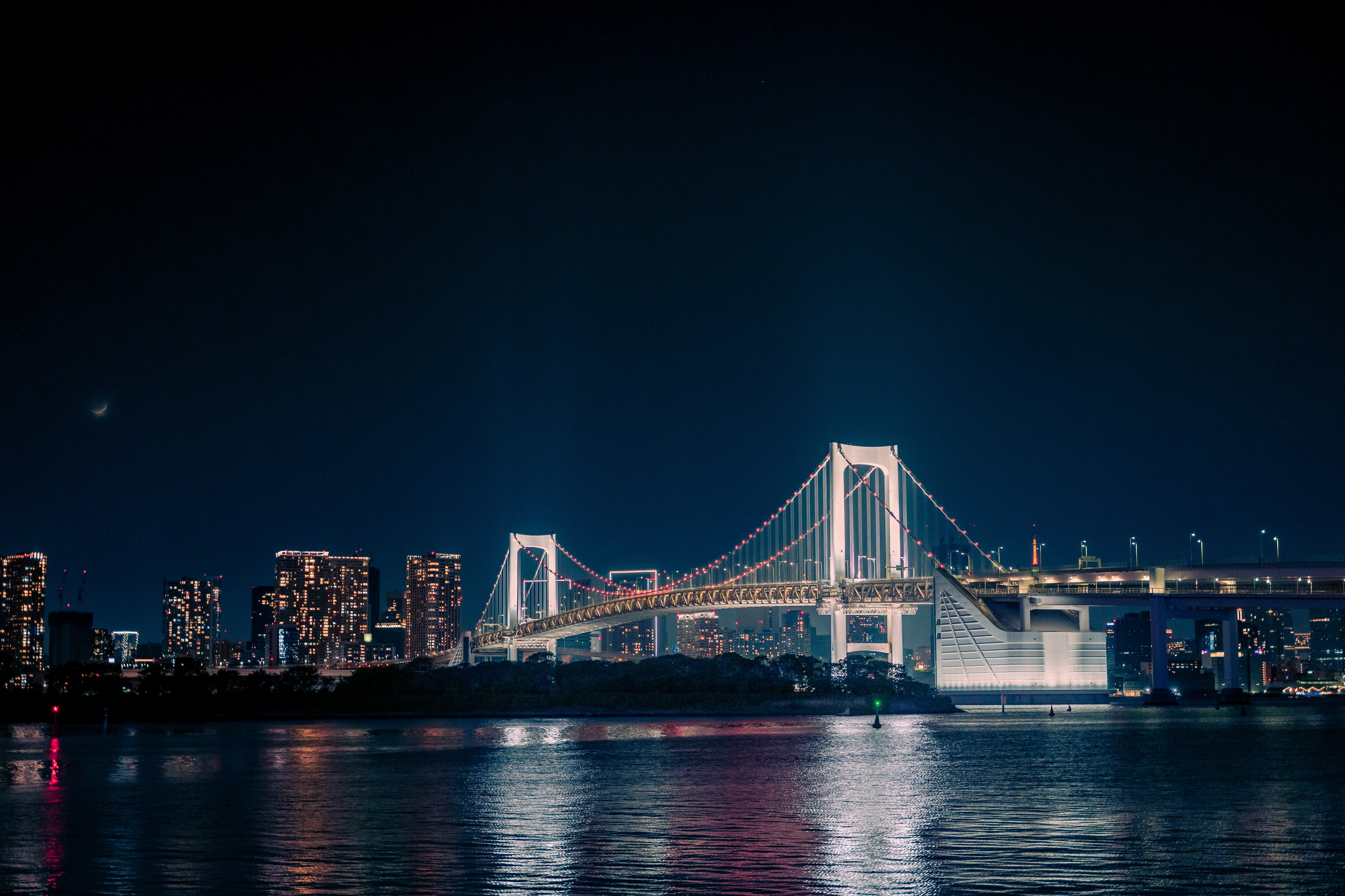 Tokyo's Radiant Night Bridge Reflections