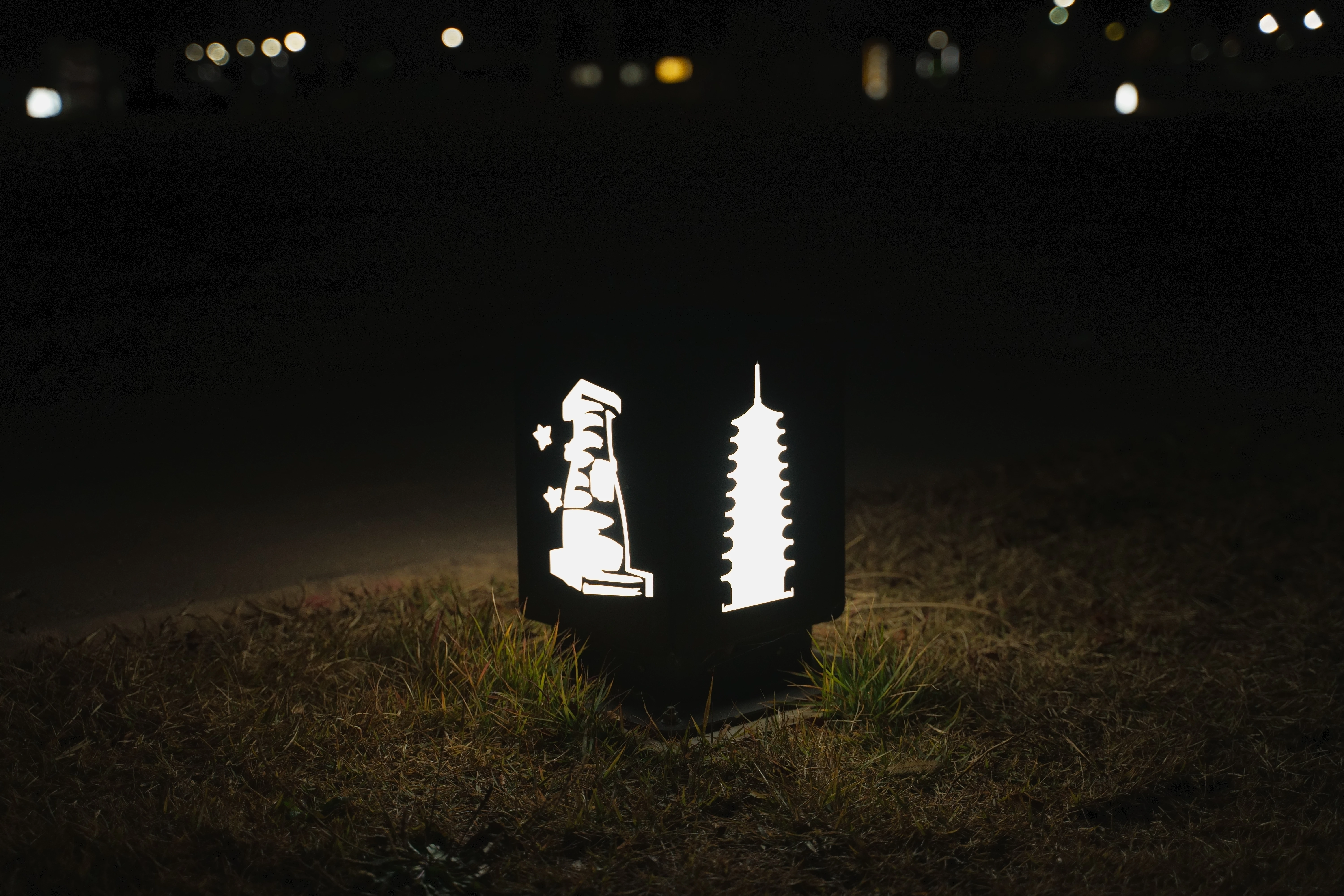 Illuminated Lantern with Architectural Patterns in the Night
