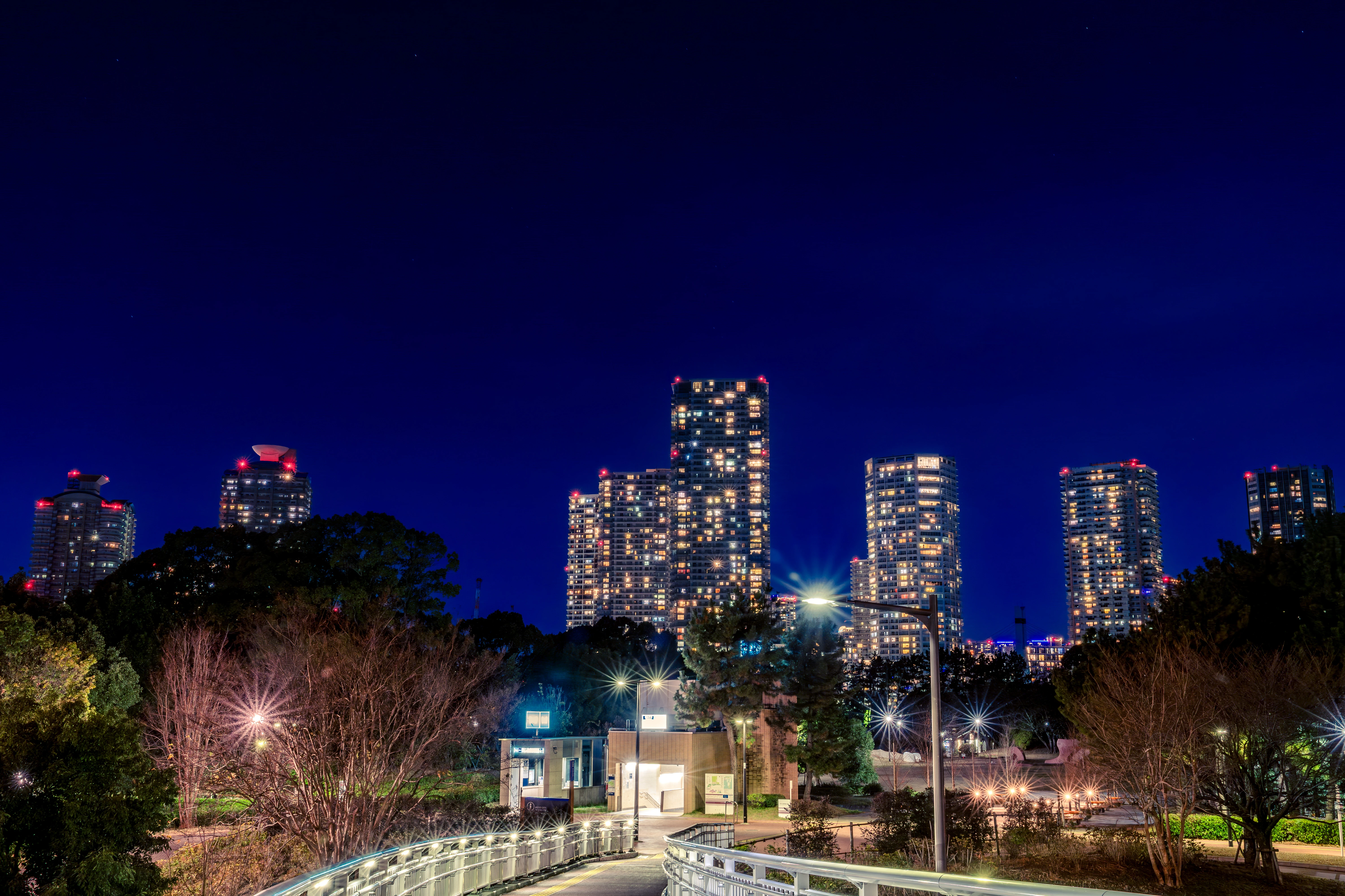 Luminous Cityscape Amidst Tranquil Evening