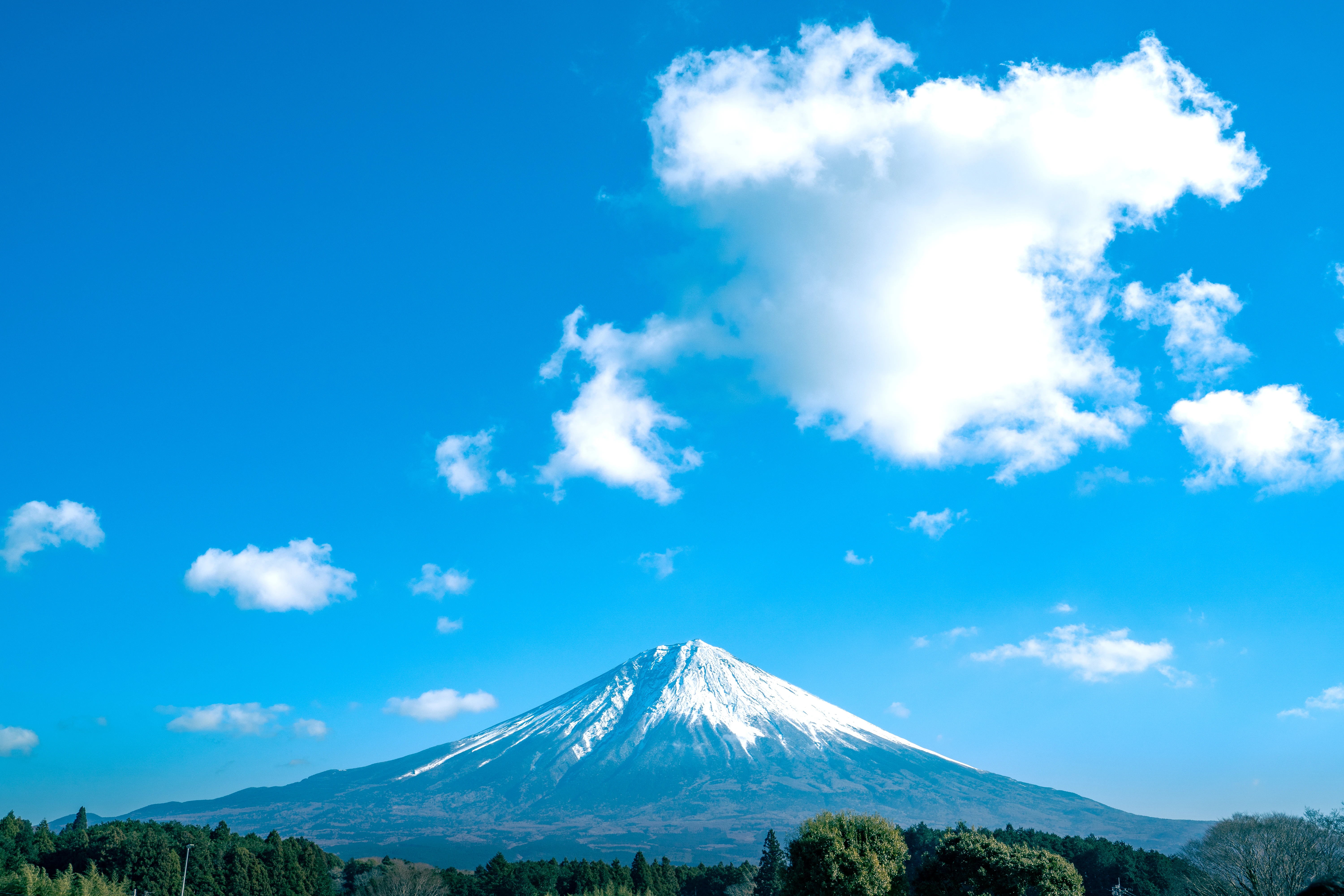 Majestic Snow-Capped Mount Fuji Under Clear Blue Skies