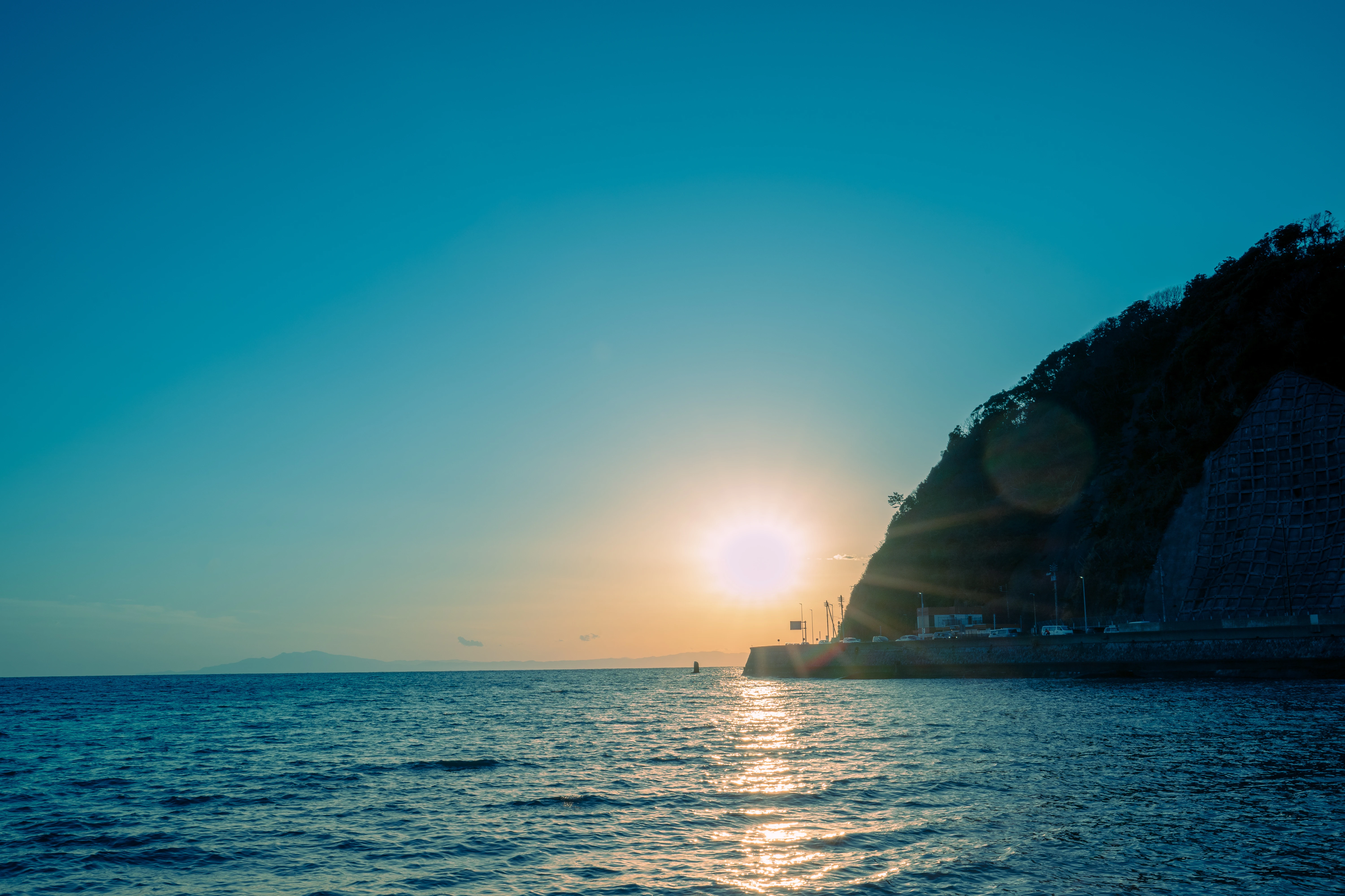 Golden Sunset Over a Tranquil Coastline