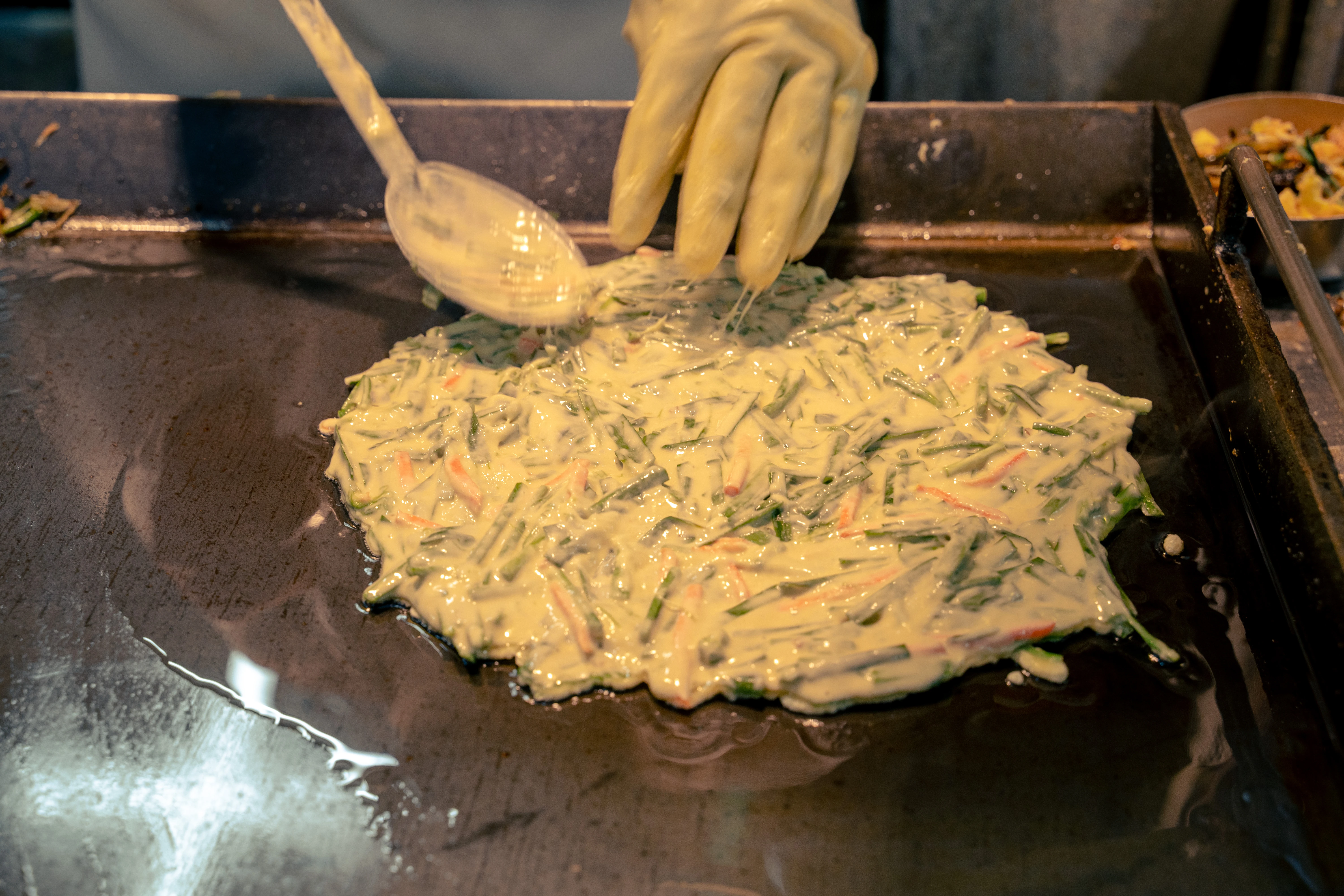 Preparation of Savory Korean Pancake on a Hot Griddle
