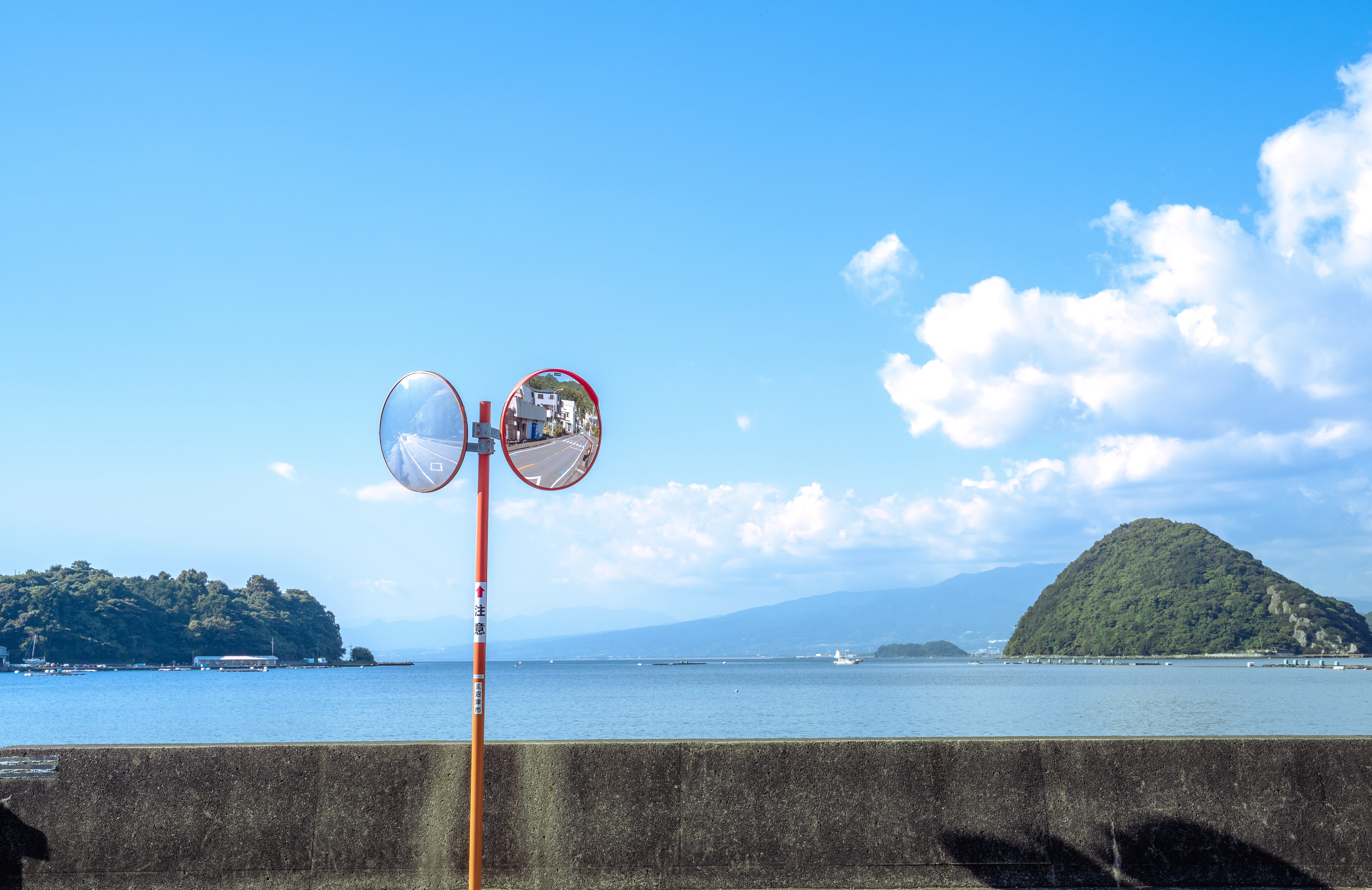 Coastal Reflections in Twin Traffic Mirrors