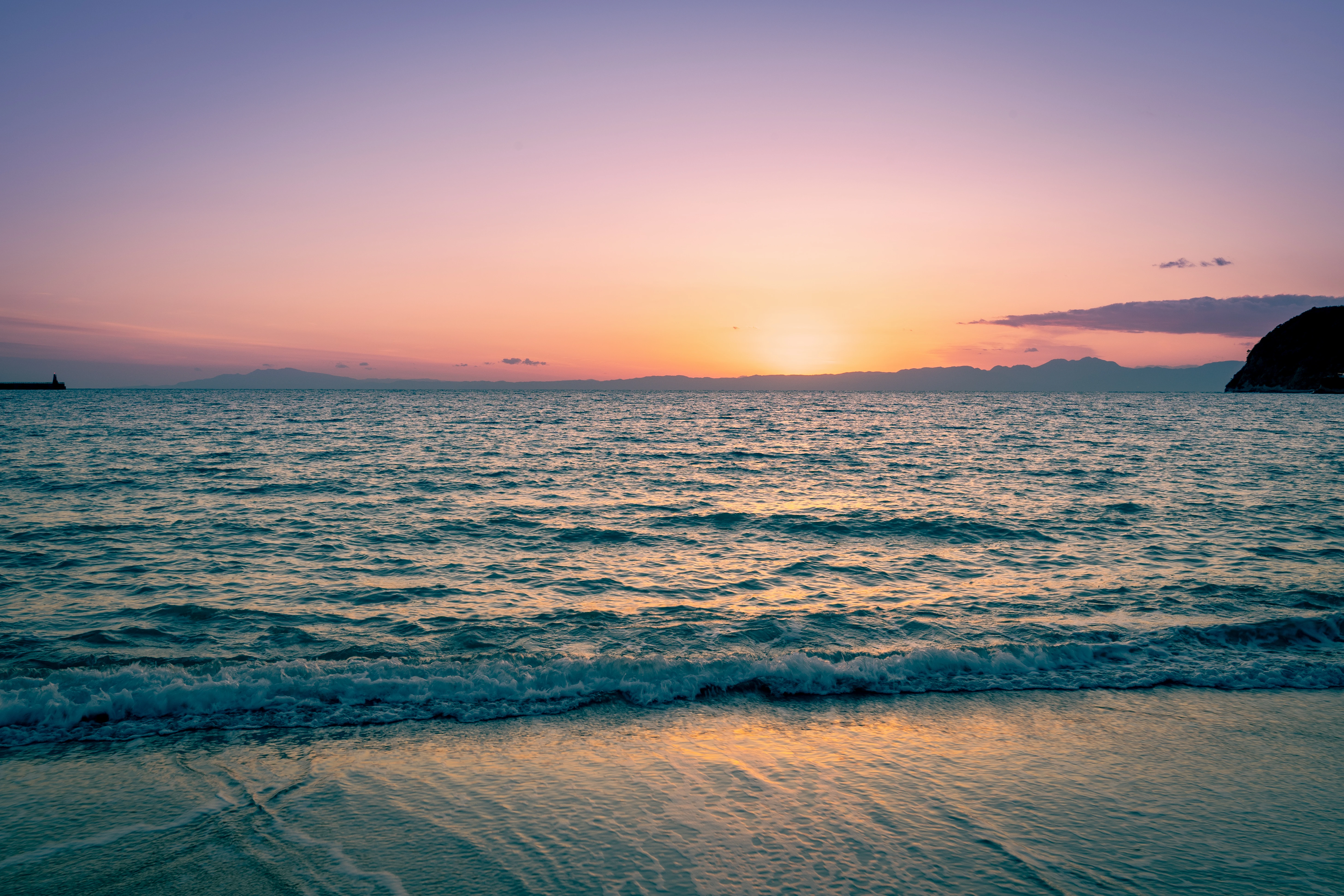 Tranquil Sunset Over Ocean Ripples