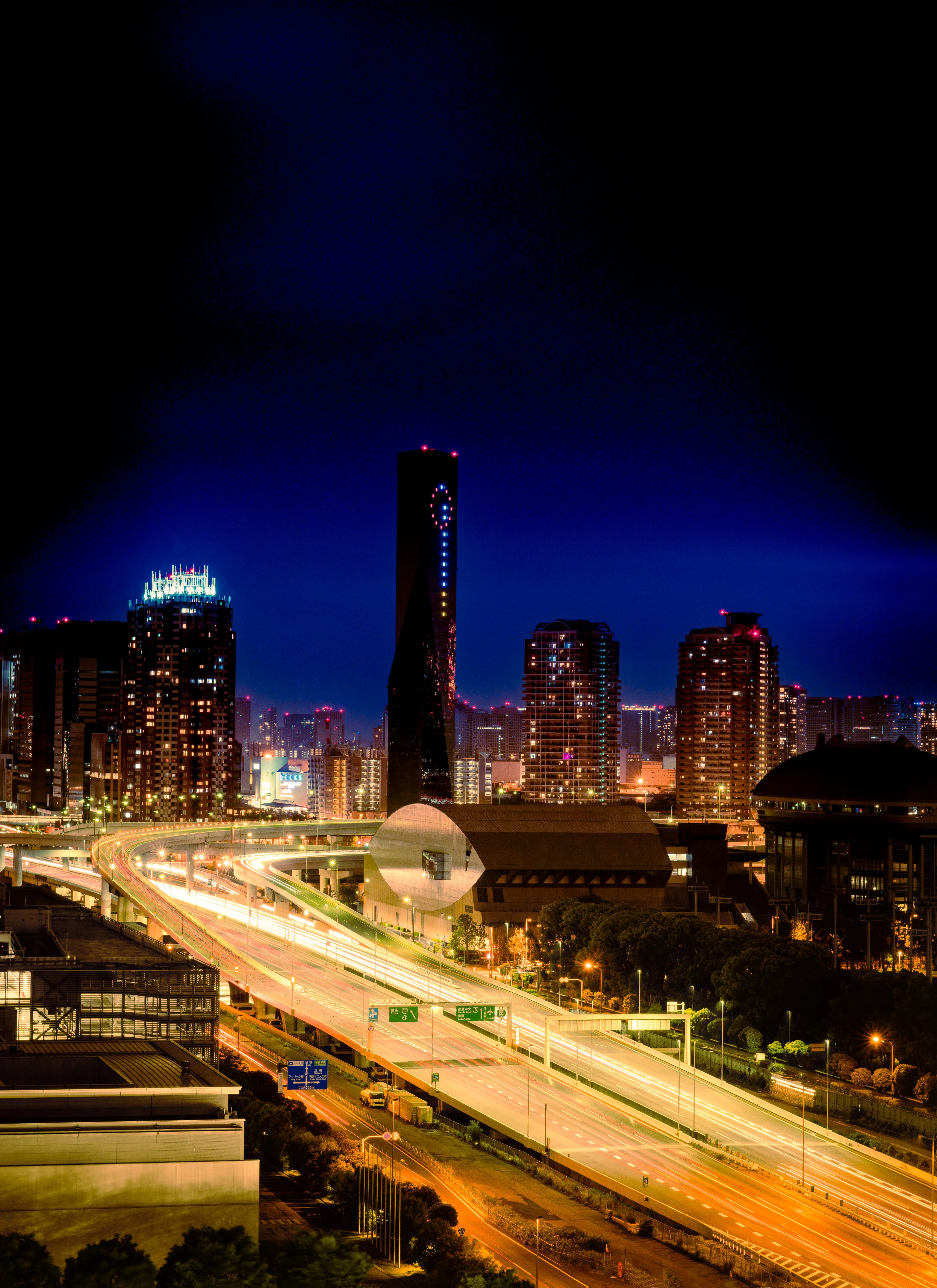 Urban Glow: Illuminated Cityscape with Dynamic Highways at Night
