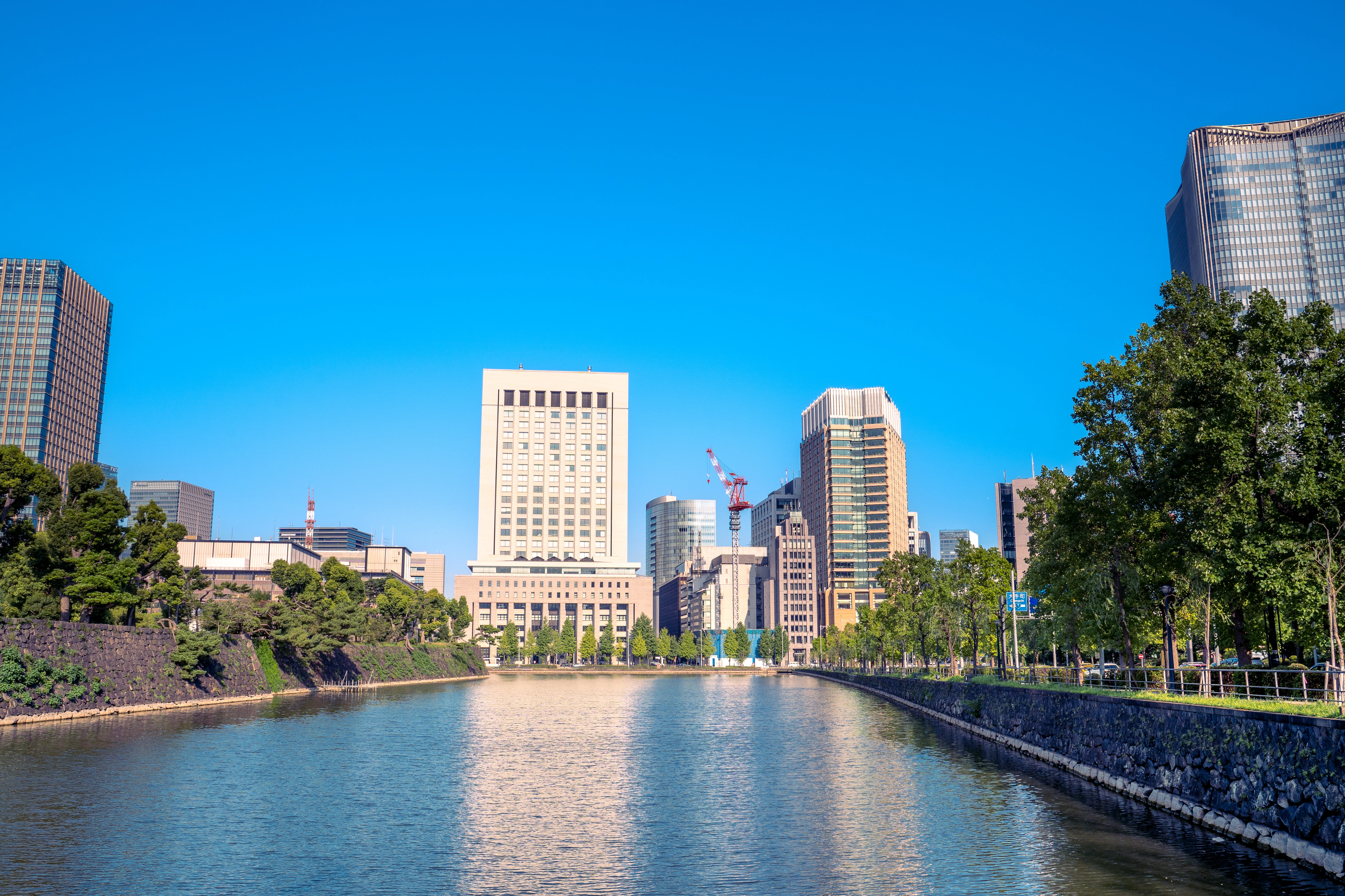 Urban Oasis: Tranquil Canal Amid Towering Skyscrapers