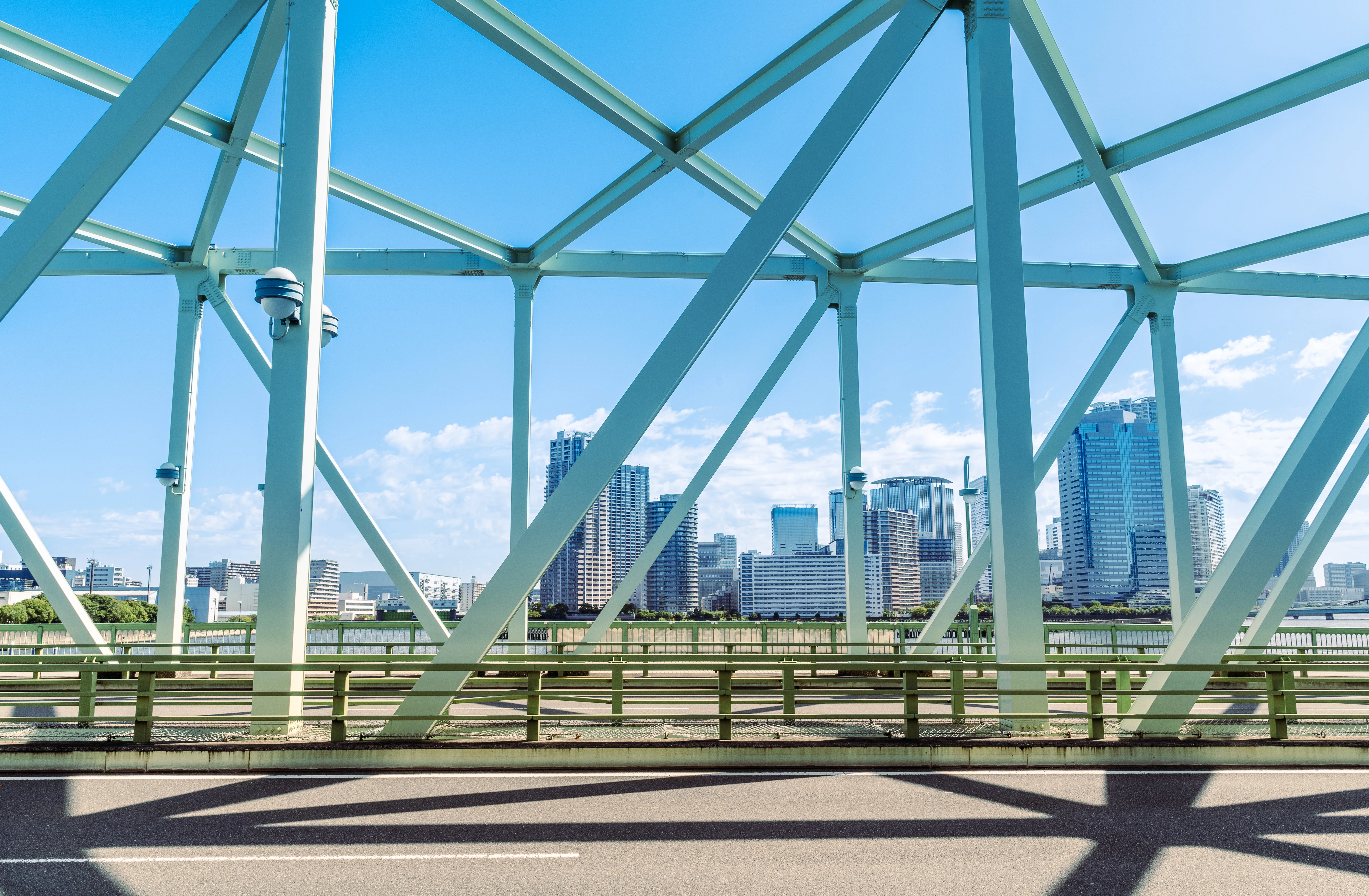 Urban Skyline Framed Through a Structural Steel Bridge
