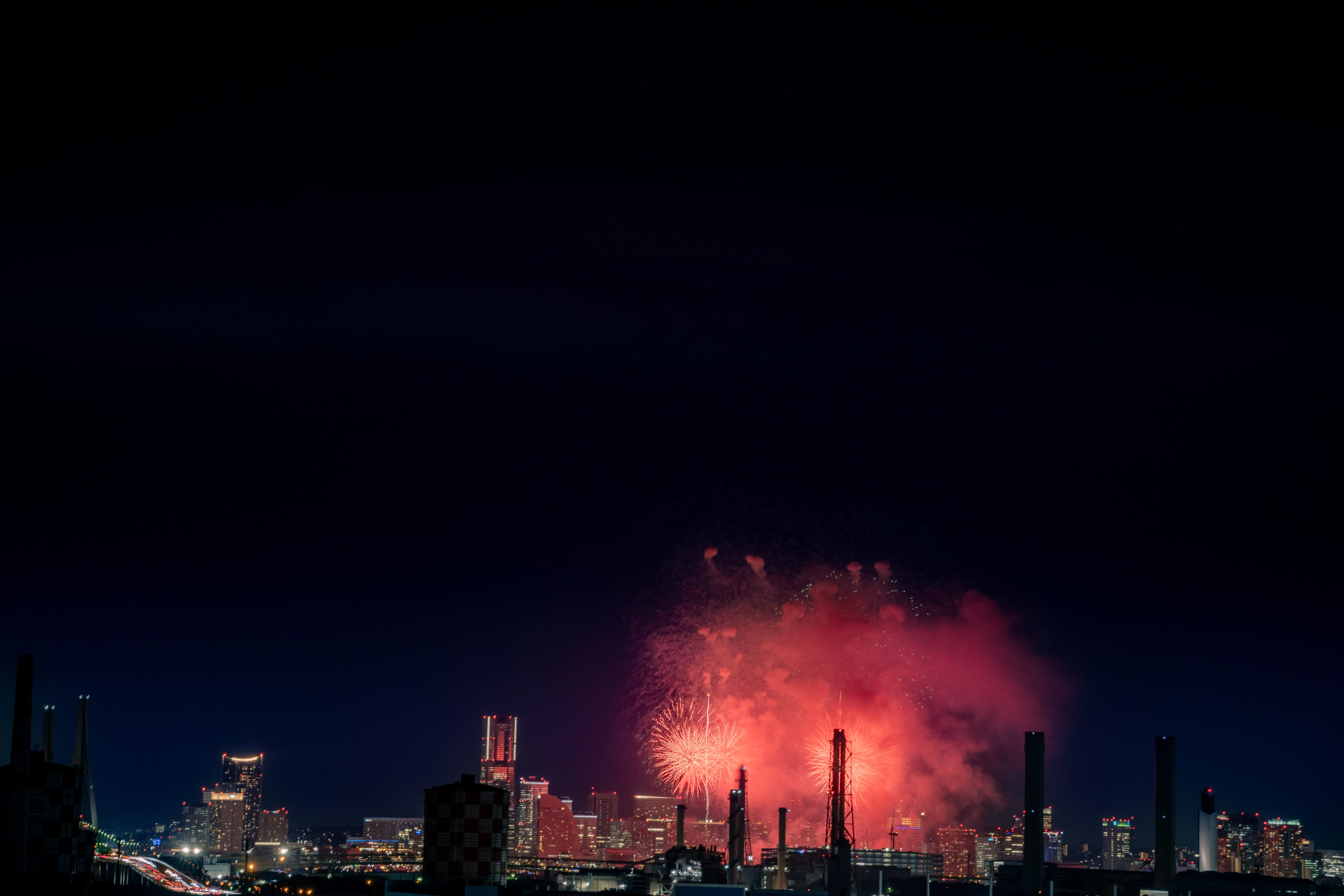 Vibrant Fireworks Over a Nocturnal Cityscape